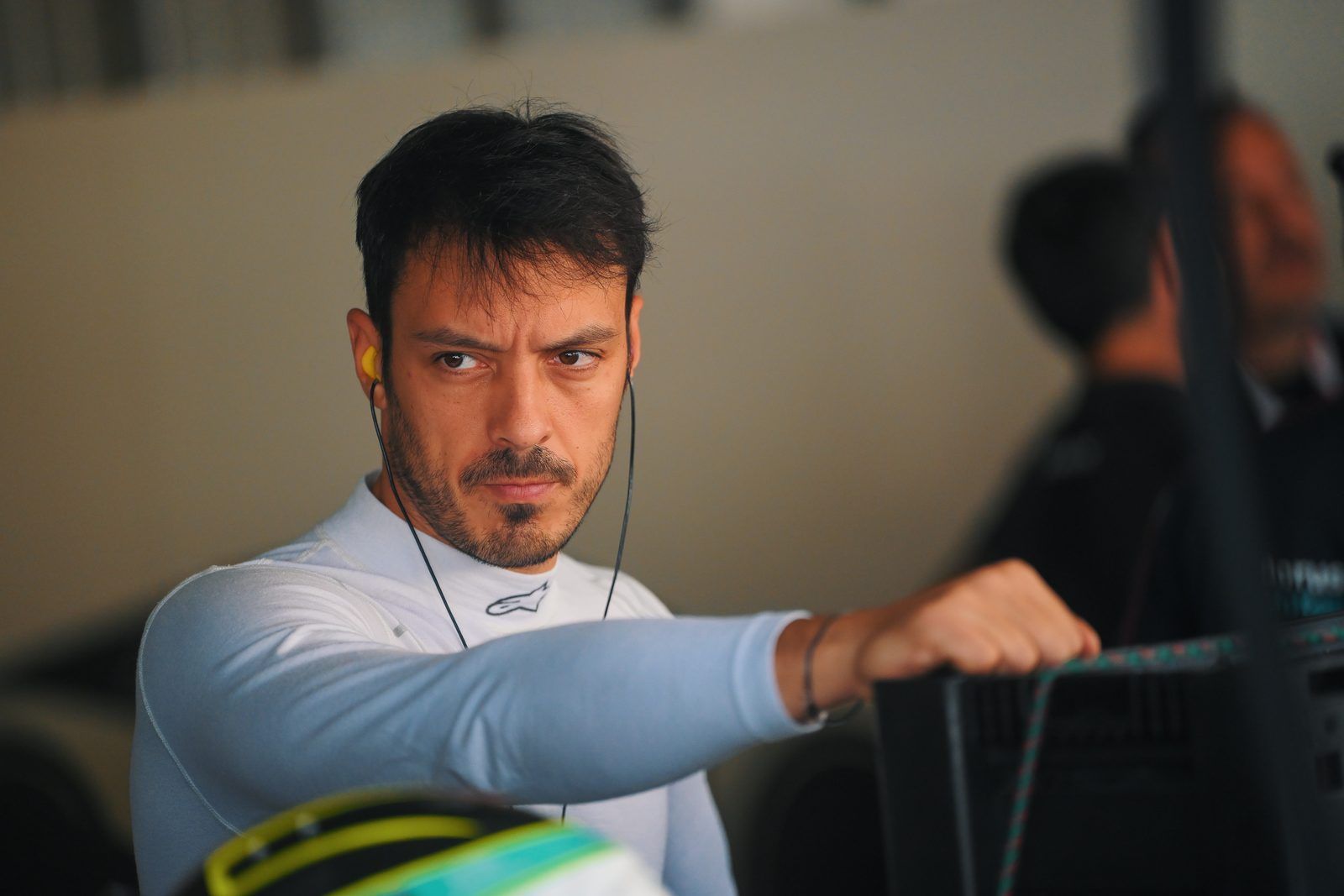 Driver watching from the pit wall
